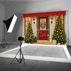 Aperturee - Aperturee Christmas Front Porch Photography Backdrop Red Door with Garland and Trees Welcoming Holiday Photo Background