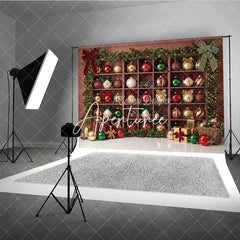 Aperturee - Aperturee Christmas Holiday Backdrop with Festive Ornaments and Gifts on Wooden Shelves Green Garlands and String Lights Decor