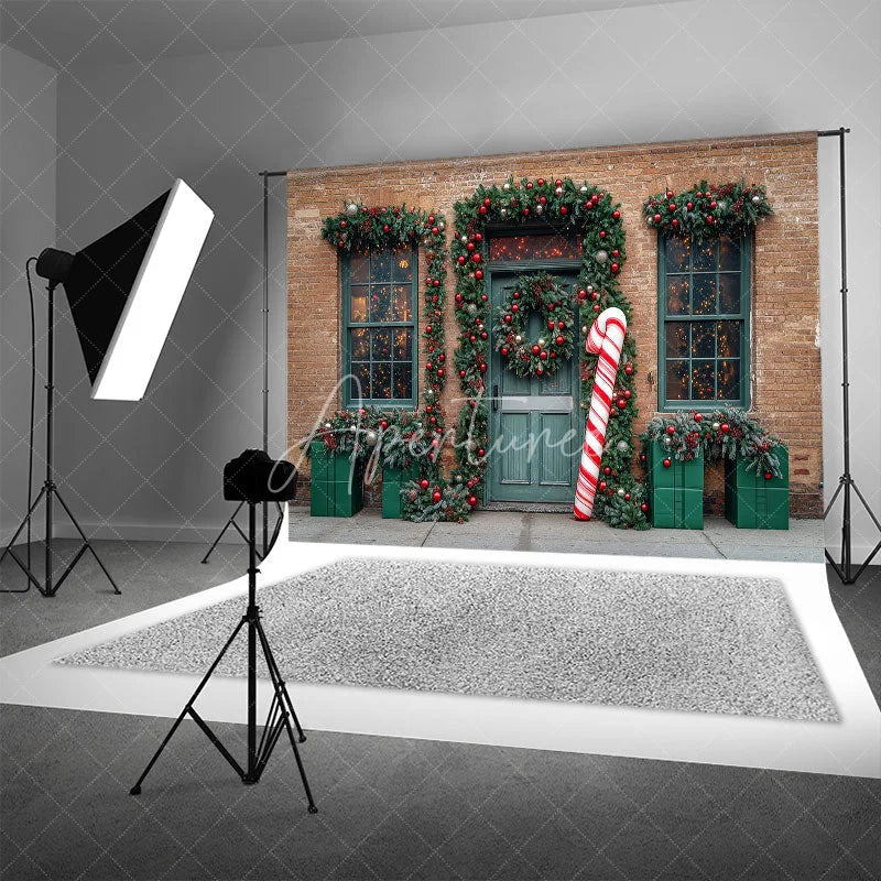 Aperturee - Aperturee Christmas Storefront Backdrop Brick Wall with Giant Candy Cane Green Door Wreaths Holiday Photo Props