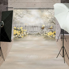 Aperturee - Aperturee Easter Egg Bicycle Backdrop Spring White Fence and Yellow Daffodils Garden Scene Holiday Photography Background