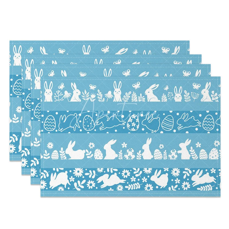 Aperturee - Aperturee Easter Set of 4 Placemats Blue Background White Silhouettes Bunny Egg Border Pattern Dining Table Mats