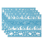 Aperturee - Aperturee Easter Set of 4 Placemats Blue Background White Silhouettes Bunny Egg Border Pattern Dining Table Mats