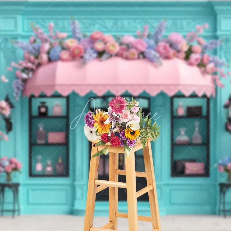 Aperturee - Aperturee Elegant Blue Boutique Storefront Photography Backdrop featuring Pink Awning Cherry Blossoms and Lush Floral Decor