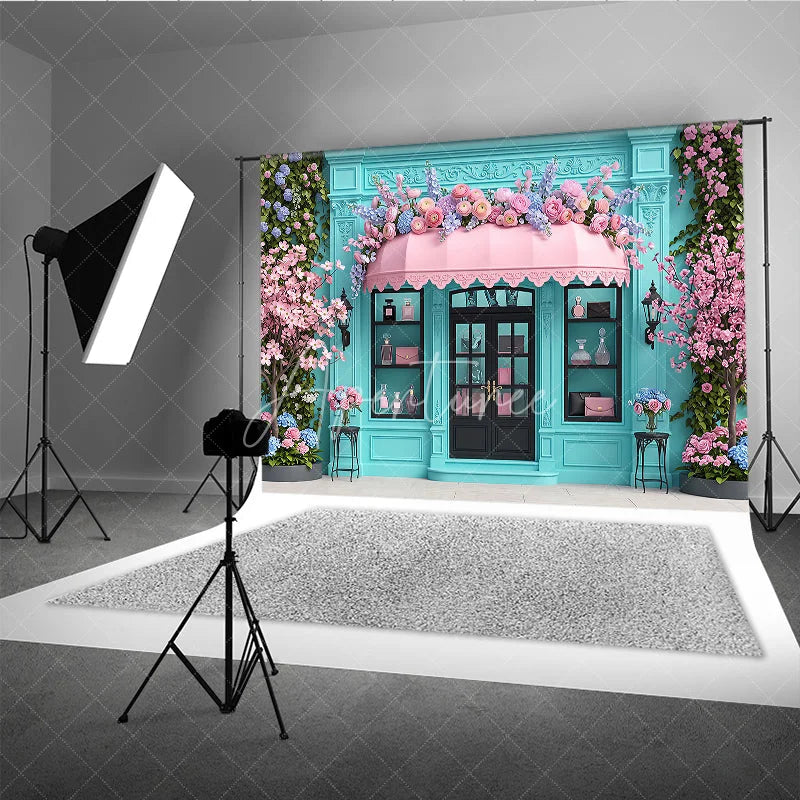Aperturee - Aperturee Elegant Blue Boutique Storefront Photography Backdrop featuring Pink Awning Cherry Blossoms and Lush Floral Decor
