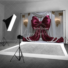 Aperturee - Aperturee Elegant Burgundy Bow with White Drapes and Gold Accents Photography Backdrop Pearl Embellishments for Celebrations