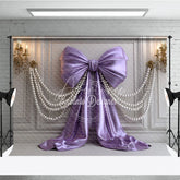 Aperturee - Aperturee Elegant Lavender Satin Bow and Pearl Strands Photography Backdrop White Paneled Wall with Gold Chandeliers