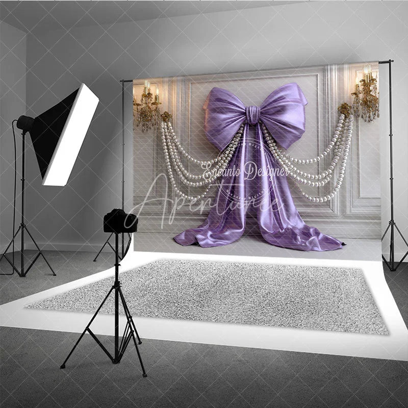 Aperturee - Aperturee Elegant Lavender Satin Bow and Pearl Strands Photography Backdrop White Paneled Wall with Gold Chandeliers