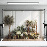 Aperturee - Aperturee Elegant White Paneled Wall with Olive Tree and Floral Arrangements Photography Backdrop Natural Light Studio Decor
