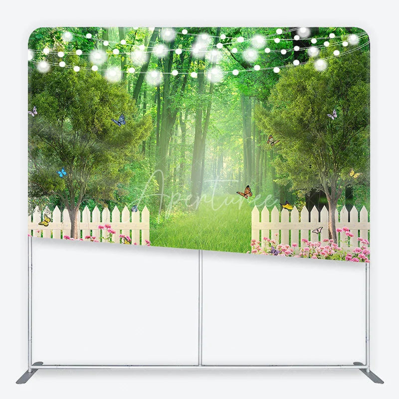 Aperturee - Aperturee Enchanted Green Forest Garden Square Double-Sided Backdrop with White Picket Fence Pink Flowers and String Lights