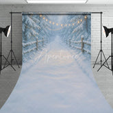 Aperturee - Aperturee Enchanting Snowy Forest Sweep Backdrop with Warm String Lights Rustic Wooden Fence Winter Path