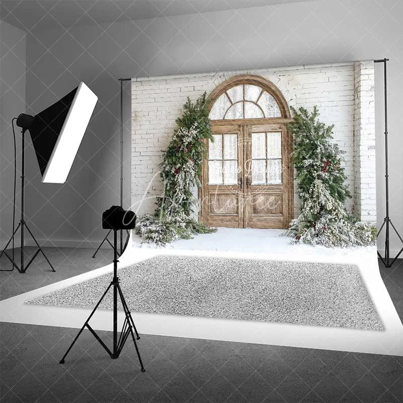 Aperturee - Aperturee Farmhouse Christmas Backdrop Rustic Wood Arched Door Snowy Pine Garland White Brick Wall Background