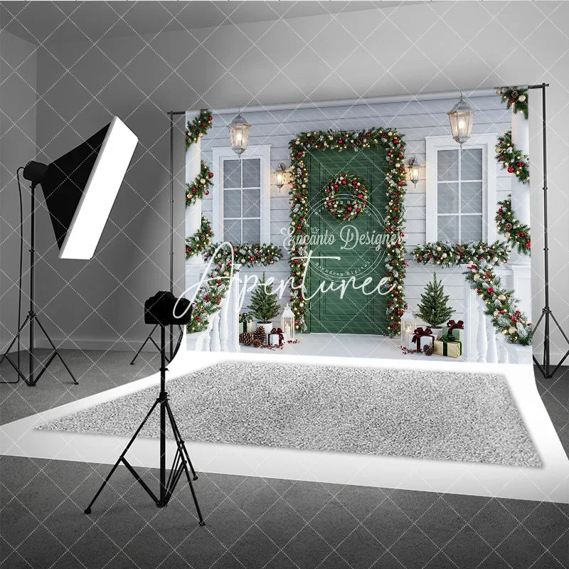 Aperturee - Aperturee Festive Christmas Porch Holiday Backdrop with Green Door Snowy Garlands Wreath and Warm Lights