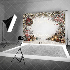 Aperturee - Aperturee Festive Snowy Pine Garland Christmas Holiday Backdrop with Warm String Lights Red Berries and Cozy Winter Gifts