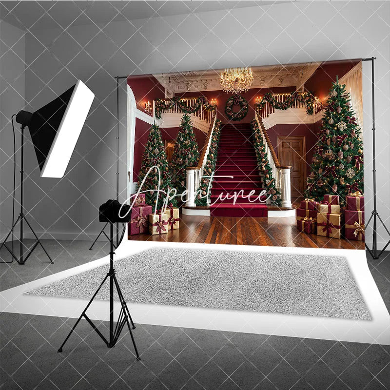 Aperturee - Aperturee Luxurious Christmas Holiday Backdrop with Grand Staircase Red Carpet Decorated Trees and Festive Garlands.