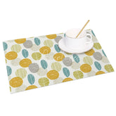 Aperturee - Aperturee Modern Yellow Circle and Green Leaves Set of 4 Placemats for Contemporary and Botanical Kitchen Decor