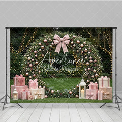 Aperturee - Aperturee Pink and Rose Gold Ornaments Evergreen Wreath Holiday Backdrop featuring a Plaid Bow and Gift Boxes with Lanterns
