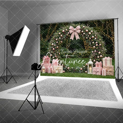 Aperturee - Aperturee Pink and Rose Gold Ornaments Evergreen Wreath Holiday Backdrop featuring a Plaid Bow and Gift Boxes with Lanterns