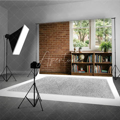 Aperturee - Aperturee Rustic Brick Wall and Window Photography Backdrop with Bookshelf Globe and Green Plants Natural Light Interior Scene