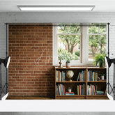 Aperturee - Aperturee Rustic Brick Wall and Window Photography Backdrop with Bookshelf Globe and Green Plants Natural Light Interior Scene
