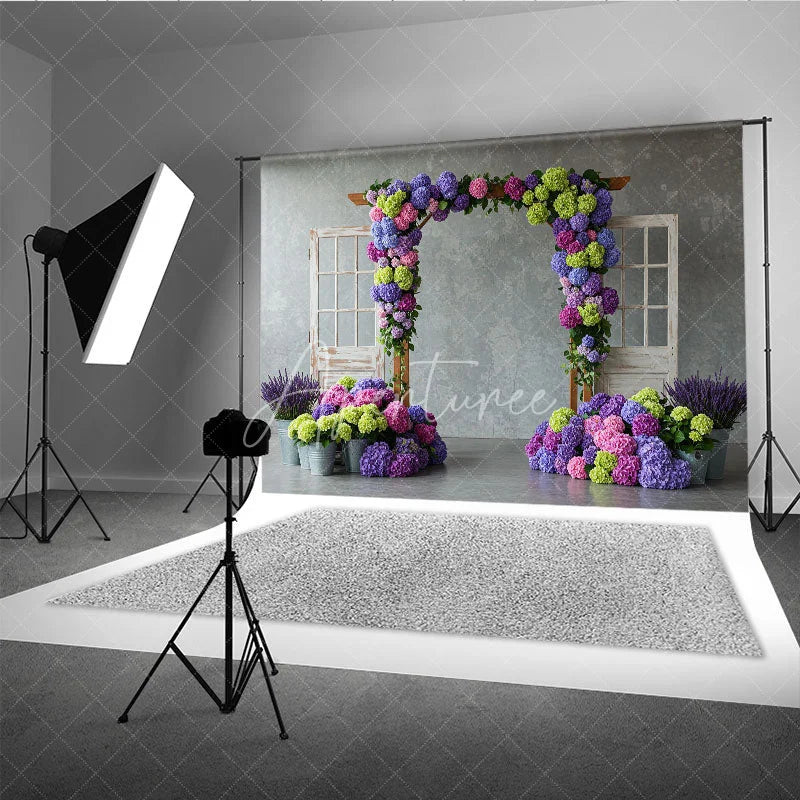 Aperturee - Aperturee Vibrant Floral Arch with Purple Pink Hydrangeas Photography Backdrop Rustic Wooden Doors for Spring Garden Party