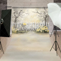 Aperturee - Aperturee Vintage Bicycle and White Fence Backdrop Yellow Flowers Spring Garden Scene Romantic Outdoor Photography