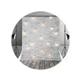 White string lights with clear bulbs, wooden frame.