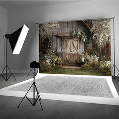 Aperturee Rustic Wooden Barn Door Photography Backdrop with Lush Greenery and White Flowers, Enchanting Garden Scene