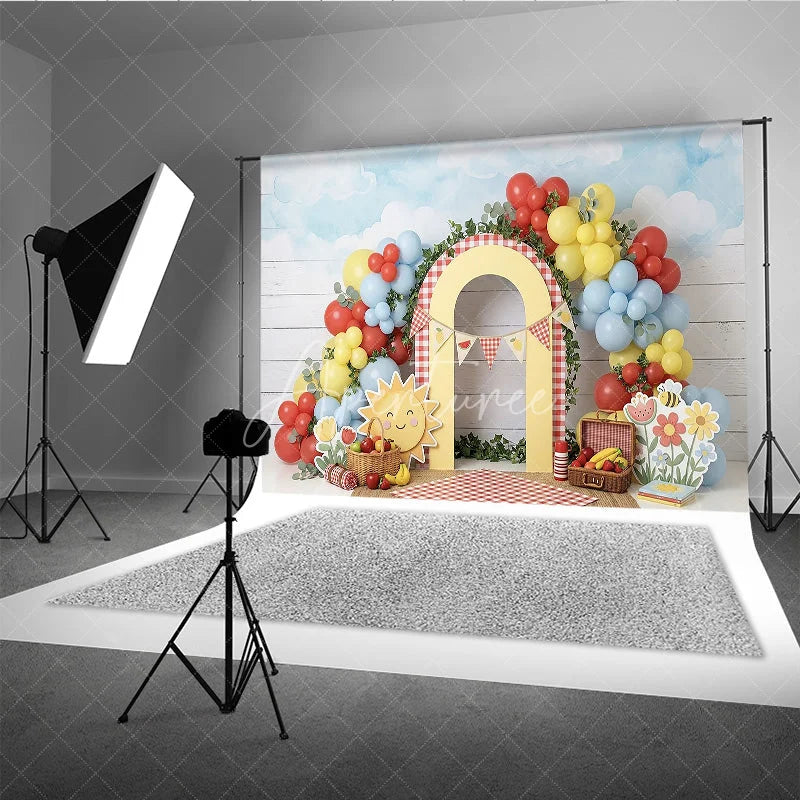 Aperturee - Aperturee Cheerful Picnic Photography Backdrop with Red Yellow Blue Balloons Gingham Arch and Summer Fruits for Birthday Party