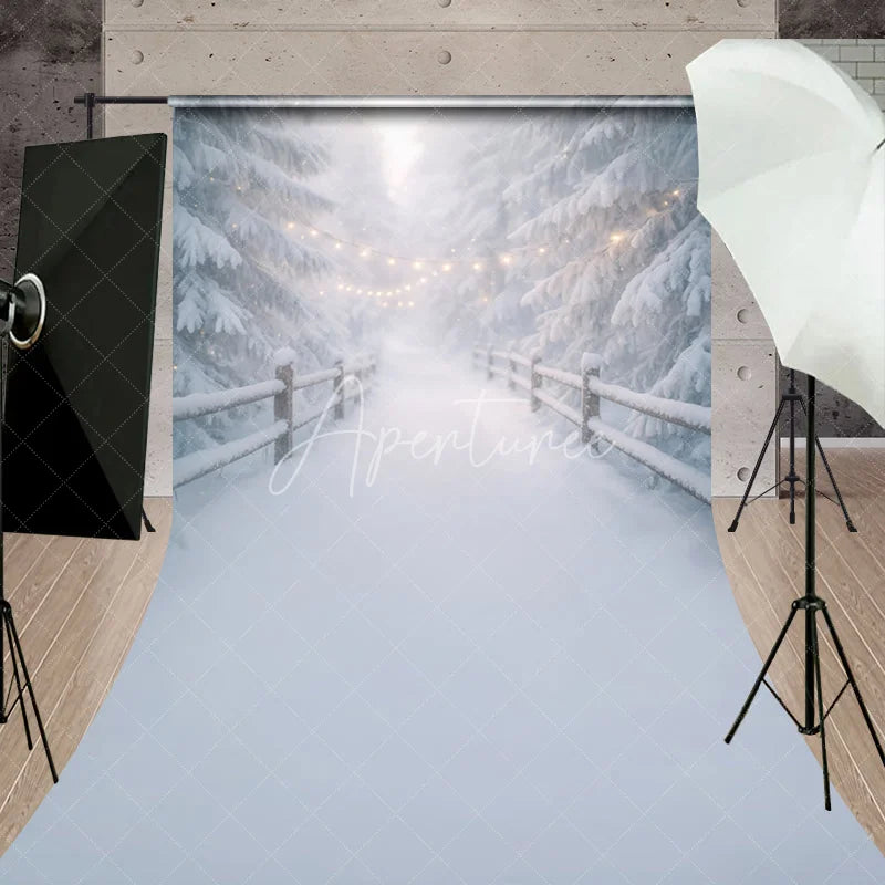 Aperturee - Aperturee Dreamy Winter Wonderland Sweep Backdrop with Snow Covered Pine Trees and Festive String Lights