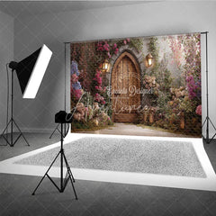 Aperturee - Aperturee Enchanted Garden Photography Backdrop with Arched Wooden Door Lush Flowers and Lanterns for Fairy Tale Theme