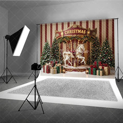 Aperturee - Aperturee Festive Christmas Carousel Horse Holiday Backdrop Elegant Snow Dusted Trees and Plaid Gift Boxes