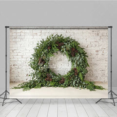 Aperturee - Aperturee Green Evergreen Wreath and Pinecone Holiday Backdrop Rustic Winter Christmas Party Decor on White Brick Wall