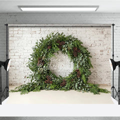 Aperturee - Aperturee Green Evergreen Wreath and Pinecone Holiday Backdrop Rustic Winter Christmas Party Decor on White Brick Wall