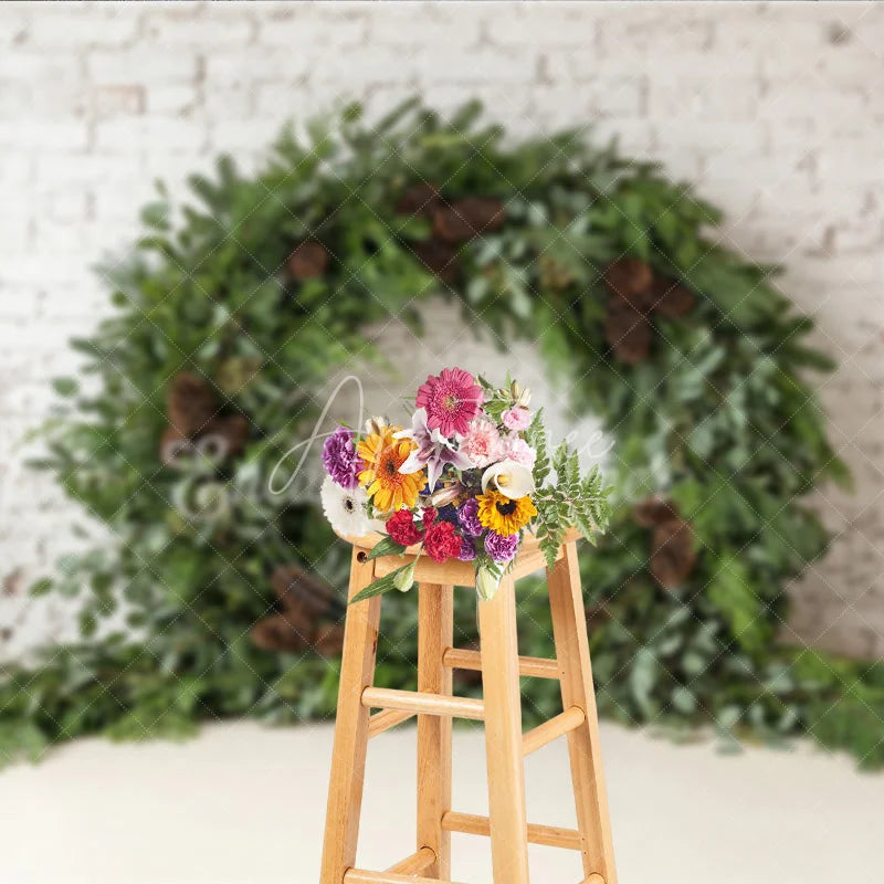 Aperturee - Aperturee Green Evergreen Wreath and Pinecone Holiday Backdrop Rustic Winter Christmas Party Decor on White Brick Wall
