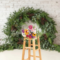 Aperturee - Aperturee Green Evergreen Wreath and Pinecone Holiday Backdrop Rustic Winter Christmas Party Decor on White Brick Wall