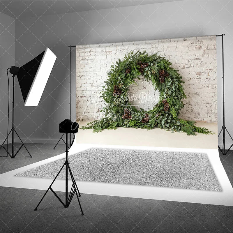 Aperturee - Aperturee Green Evergreen Wreath and Pinecone Holiday Backdrop Rustic Winter Christmas Party Decor on White Brick Wall