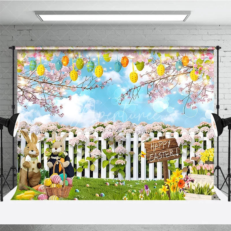 Aperturee - Aperturee Happy Easter Backdrop Bunnies and Basket in Flower Garden with White Fence Background Spring Nature Party Decor