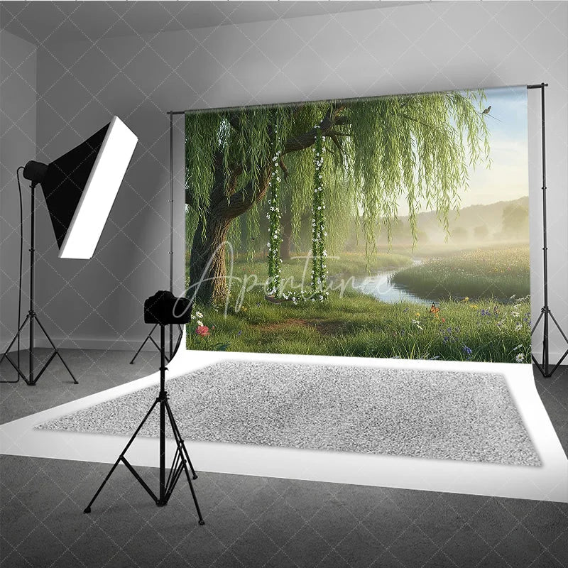 Aperturee - Aperturee Lush Green Willow Tree Photography Backdrop with Floral Swing Serene River and Spring Meadow Scene