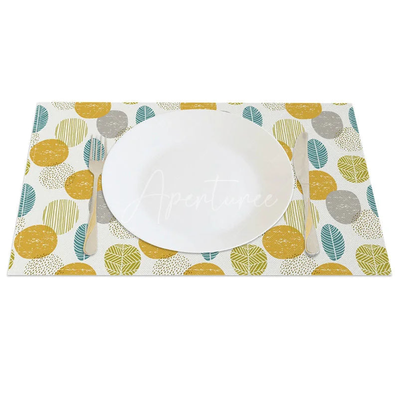 Aperturee - Aperturee Modern Yellow Circle and Green Leaves Set of 4 Placemats for Contemporary and Botanical Kitchen Decor