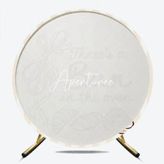 Aperturee - Aperturee Neutral Striped There’s a Bun in the Oven Round Backdrop Baked Goods and Ribbon for Baby Shower Decor.
