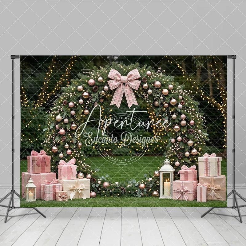 Aperturee - Aperturee Pink and Rose Gold Ornaments Evergreen Wreath Holiday Backdrop featuring a Plaid Bow and Gift Boxes with Lanterns