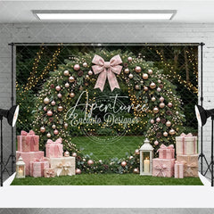 Aperturee - Aperturee Pink and Rose Gold Ornaments Evergreen Wreath Holiday Backdrop featuring a Plaid Bow and Gift Boxes with Lanterns
