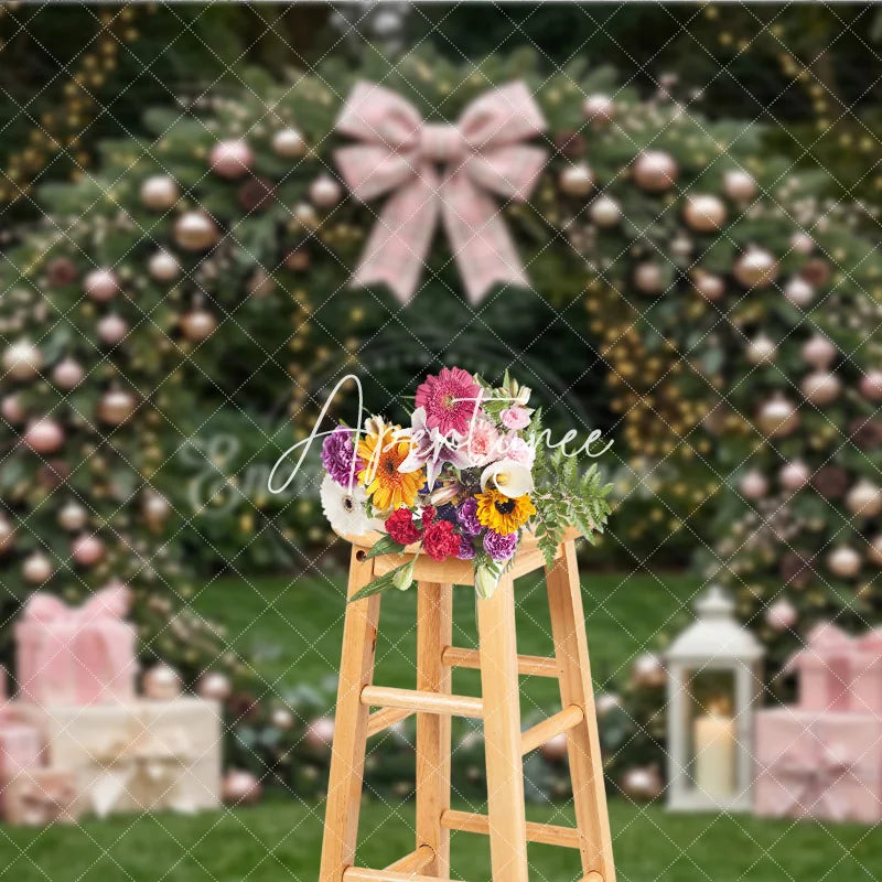 Aperturee - Aperturee Pink and Rose Gold Ornaments Evergreen Wreath Holiday Backdrop featuring a Plaid Bow and Gift Boxes with Lanterns