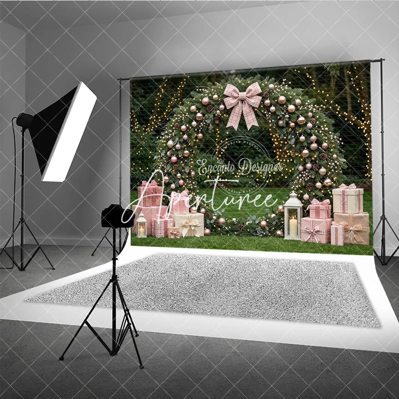 Aperturee - Aperturee Pink and Rose Gold Ornaments Evergreen Wreath Holiday Backdrop featuring a Plaid Bow and Gift Boxes with Lanterns