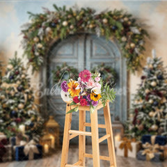 Aperturee - Aperturee Rustic Blue Door Holiday Backdrop with Festive Garland and Snow-Dusted Christmas Trees Elegant Gifts and Lanterns