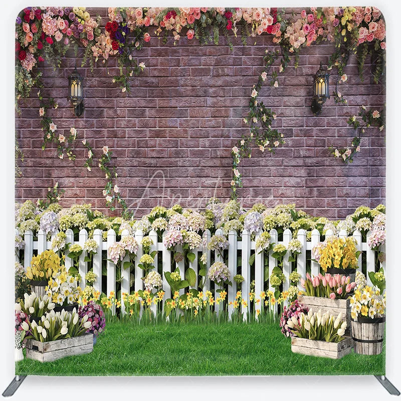 Aperturee - Aperturee Rustic Brick Wall Floral Garlands and White Picket Fence Square Double-Sided Backdrop Vibrant Spring Garden Party