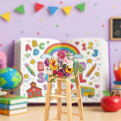 Aperturee - Aperturee Vibrant Back to School Photography Backdrop featuring a Colorful Open Book with Rainbow and School Supplies