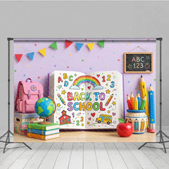Aperturee - Aperturee Vibrant Back to School Photography Backdrop featuring a Colorful Open Book with Rainbow and School Supplies
