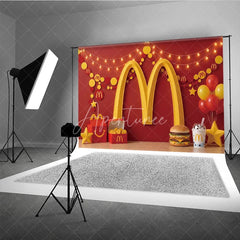 Aperturee - Aperturee Vibrant Red and Yellow Golden Arch Photography Backdrop Festive Party Decor with Balloons Snacks and String Lights.