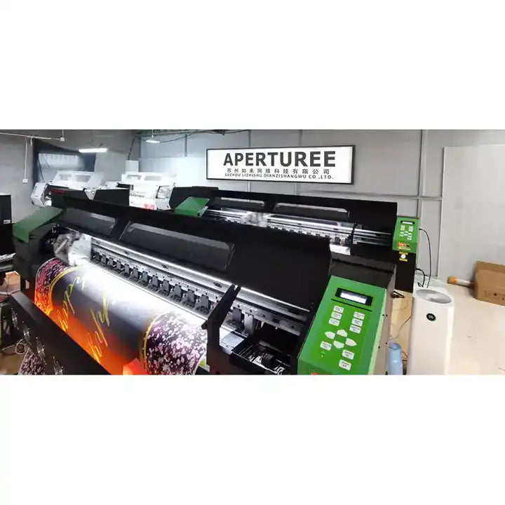 Large black and orange flame design vinyl cutter machine with green control panel, aperturee brand.